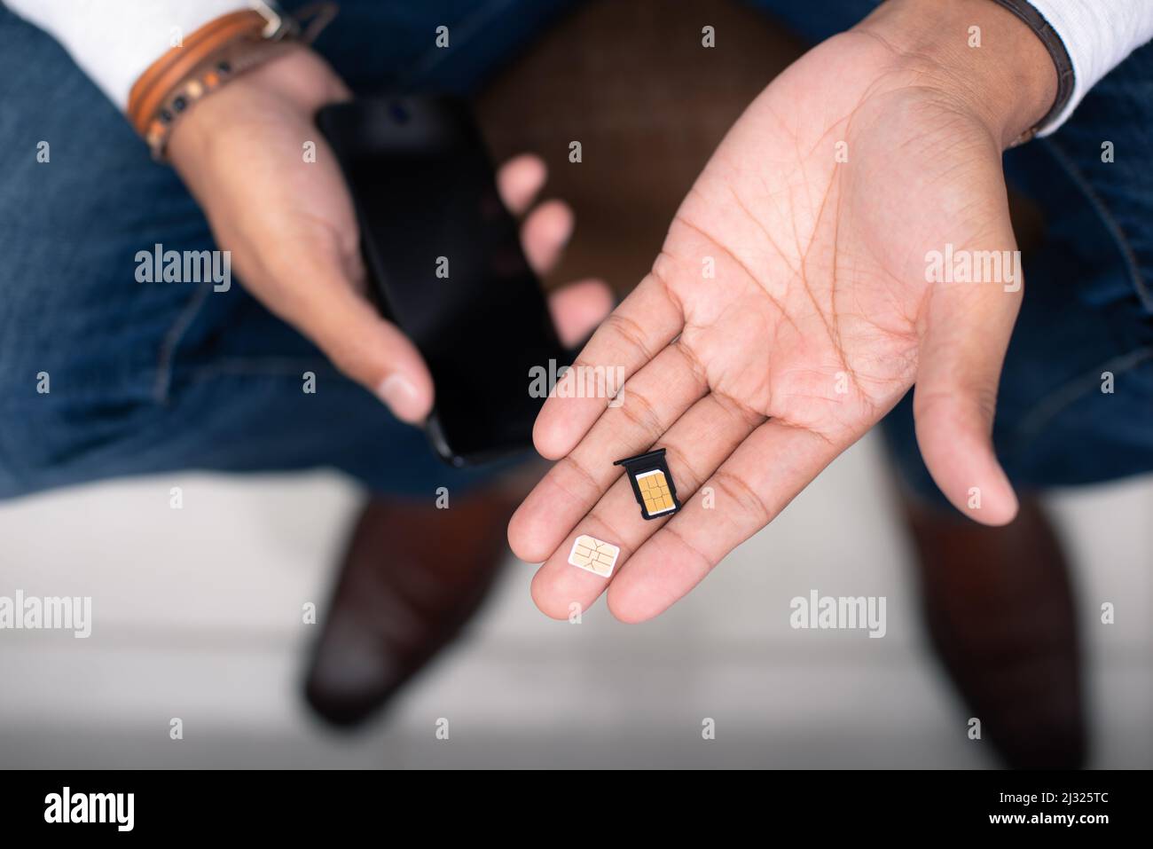 SIM Card For Smart Phone The Man Changing The SIM Card Stock Photo Alamy