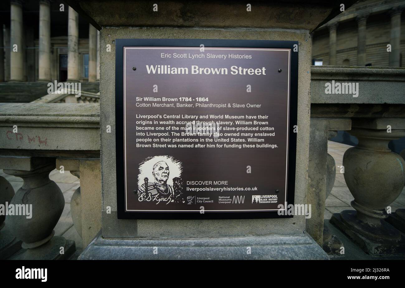 A newly unveiled bronze plaque close to the World Museum on William Brown Street, Liverpool, which explains the history behind the street name and its origins with the slave trade. It is the first of around ten streets which will become home to an 'Eric Scott Lynch Slavery Histories' plaque - named in honour of the activist and historian who passed away last year. Picture date: Tuesday April 5, 2022. Stock Photo
