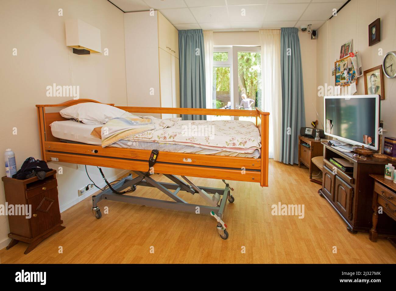 Netherlands, room in a nursing home for elderly with a high low bed