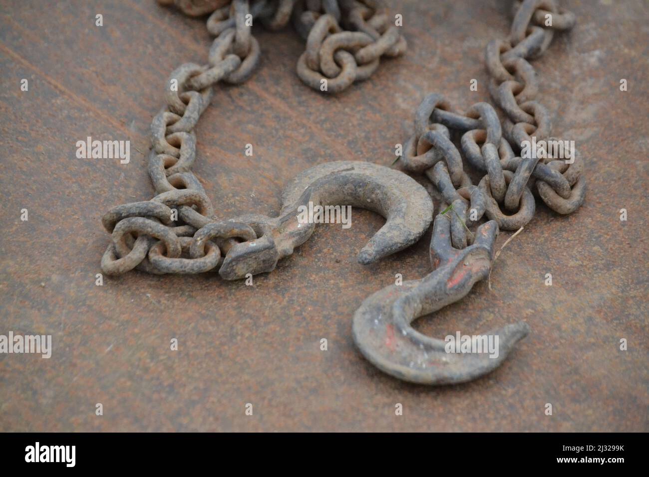 Heavy Duty Link Chain And Hooks For Lifting Items Placed On Metal Sheet Two Foundry Hooks