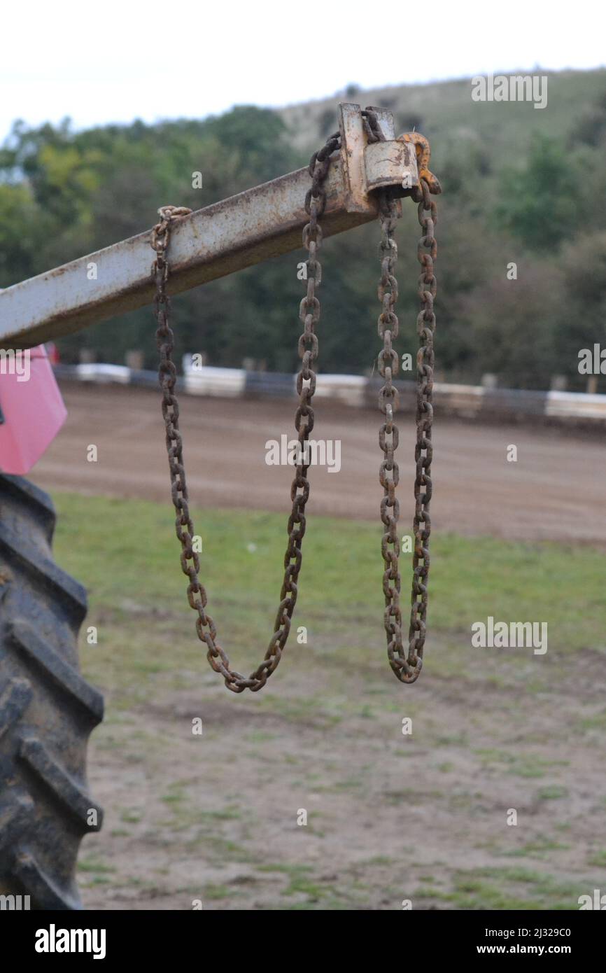 Heavy Duty Link Chain And Hooks For Lifting Items Hanging From Tractor Arm - Two Foundry Hooks - Racing Track Equipment - Yorkshire - UK Stock Photo
