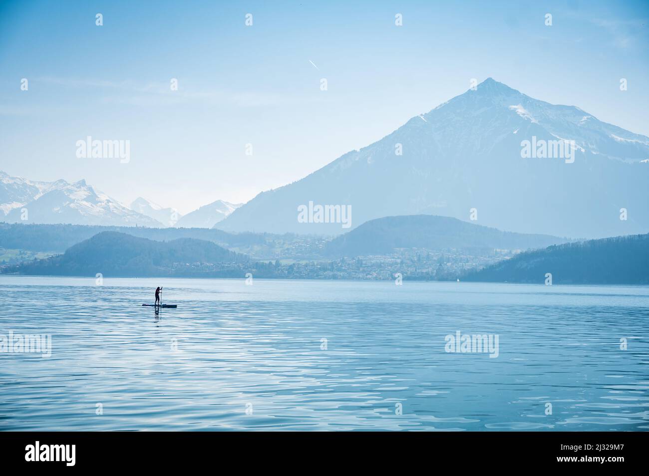 Standup Paddler in front of Niesen on Lake Thun Stock Photo Alamy