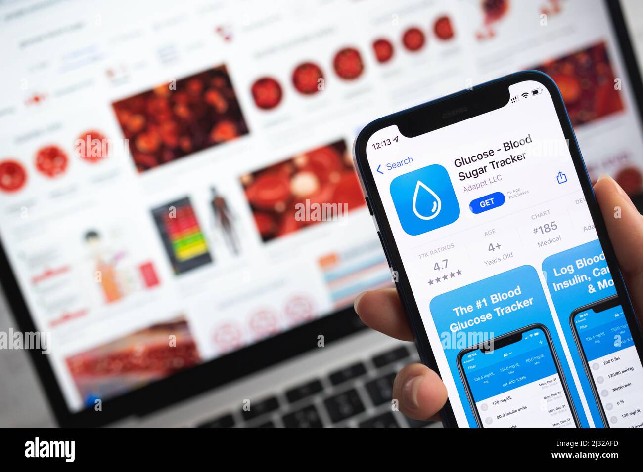 Glucose Blood Sugar Tracker app icon. Woman use mobile phone with application tracker photo Stock Photo