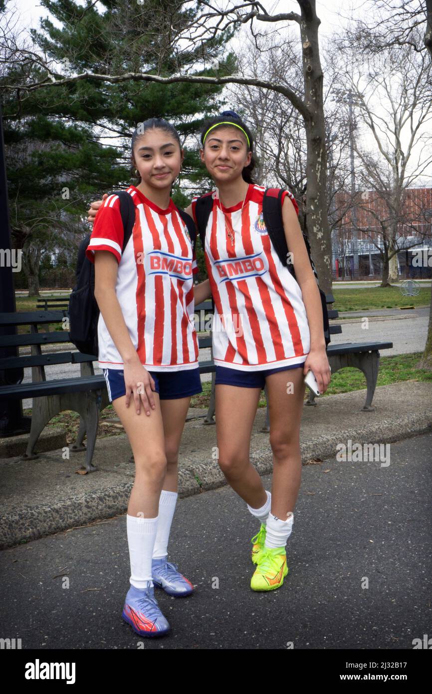 A posed portrait of soccer teammates leaving a park after finishing a game that they won. In Queens, New York. Stock Photo