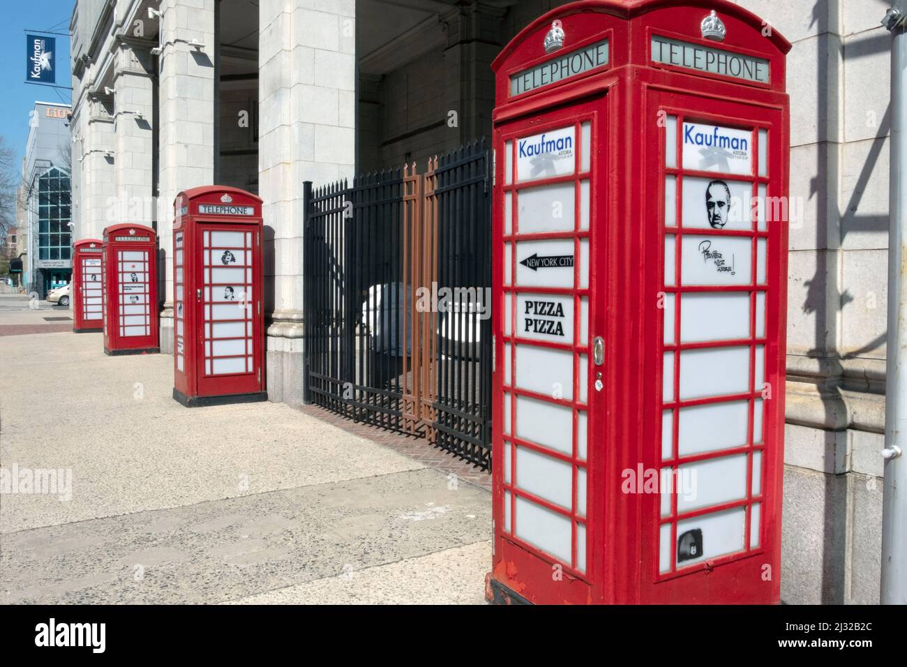 Decorative British style phone booth on display on 35th Avenue in Astoria, Queens, near the Kaufman Studios entrance. New York City. Stock Photo