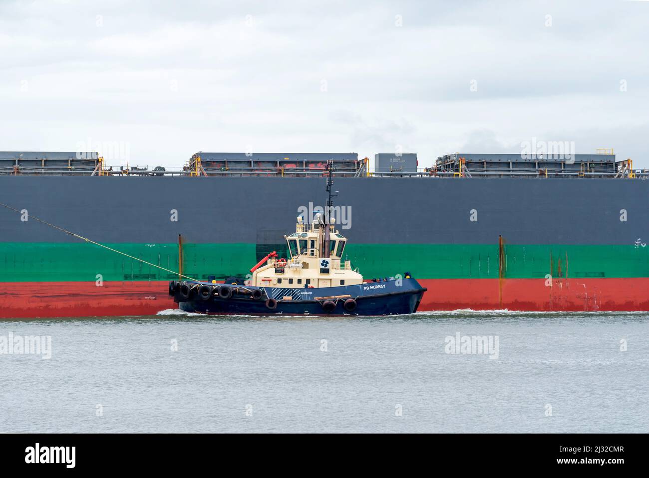 28th February 2022: The bulk ore carrier ship Rising Sun, registered in Japan, enters Newcastle Harbour in Australia Stock Photo
