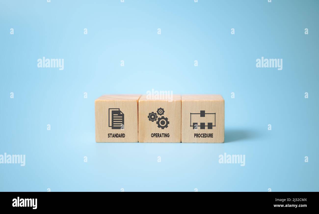 Standard Operating Procedure - SOP business concept. Instructions to assist employees in complex routine operations. The wooden cubes with 'Standard O Stock Photo