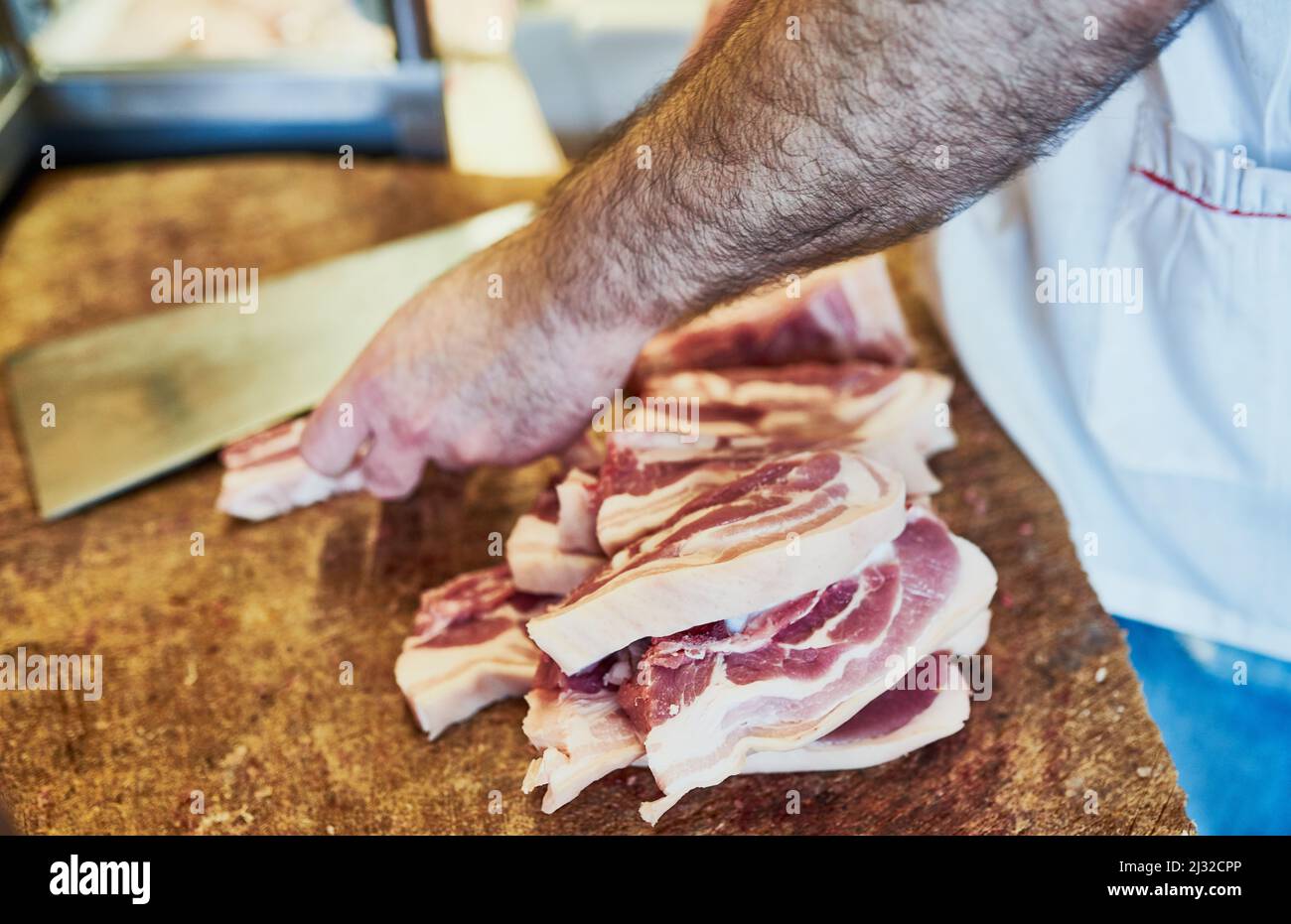 Hes a perfectionist when it comes to his job. Shot of a butcher at his store. Stock Photo