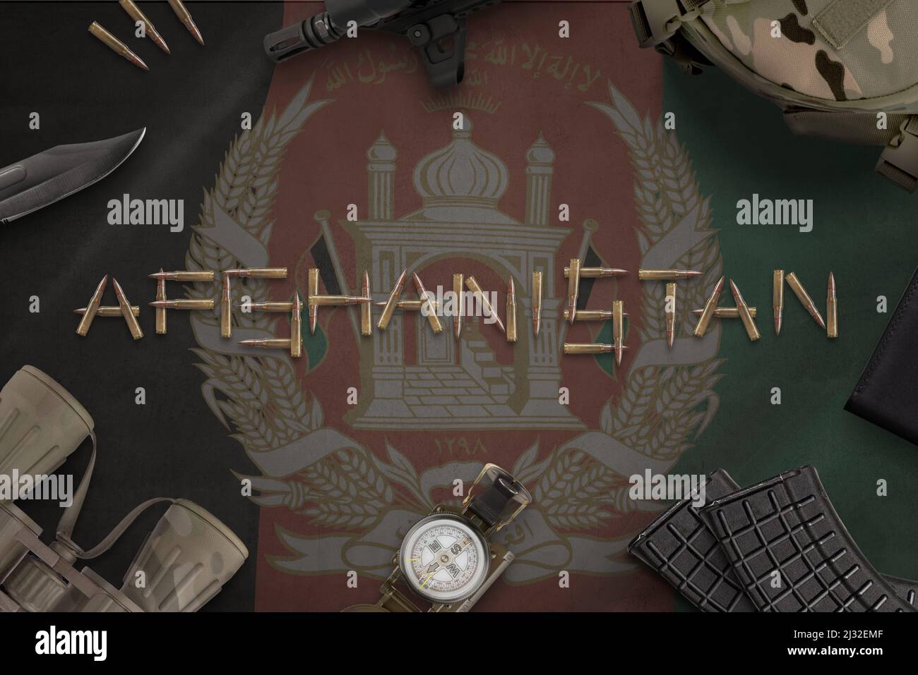 Afghanistan inscribed with bullets on the flag surrounded by military equipment. Taliban conflict concept Stock Photo