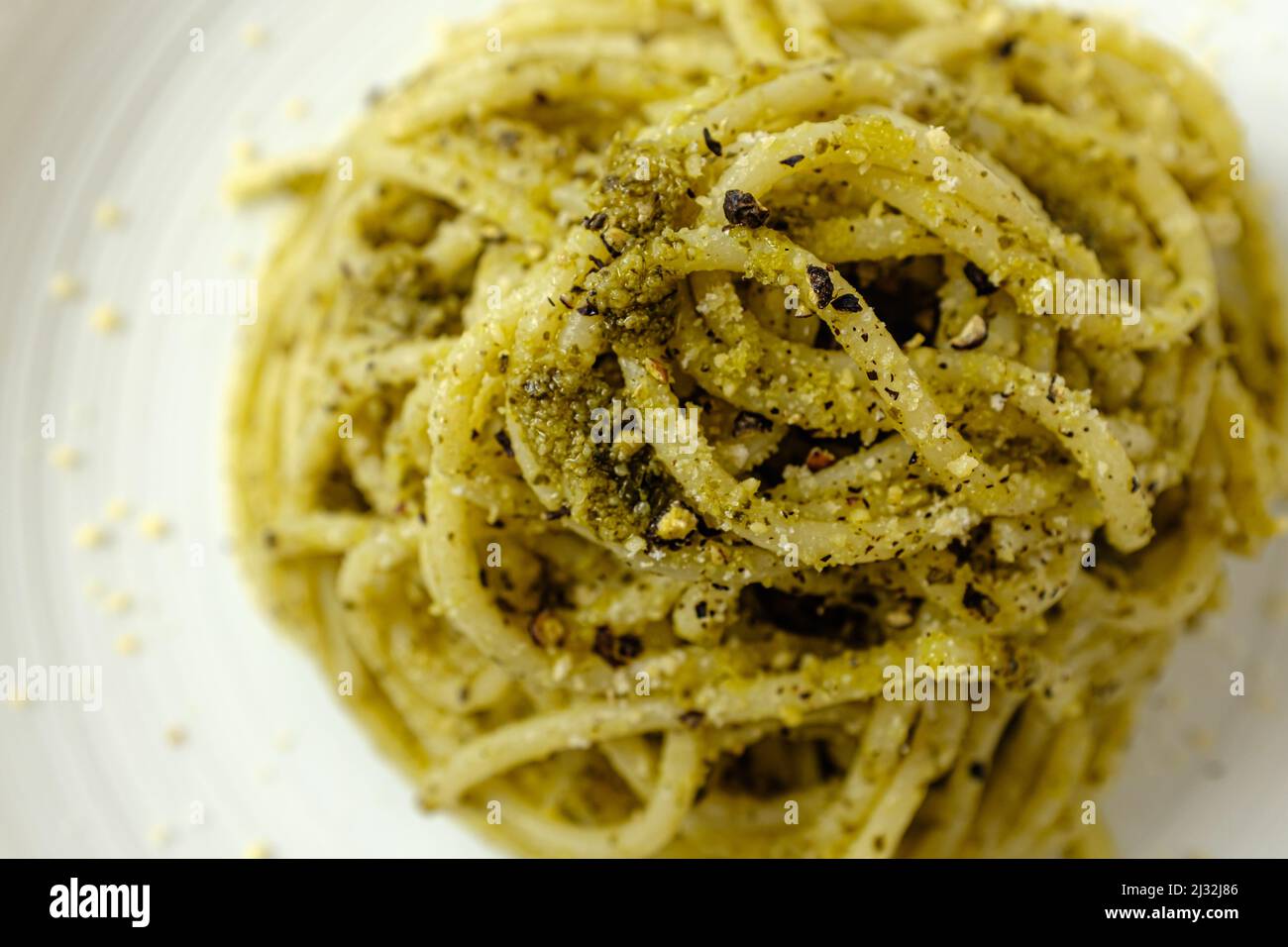 basil pesto pasta on a white background Stock Photo