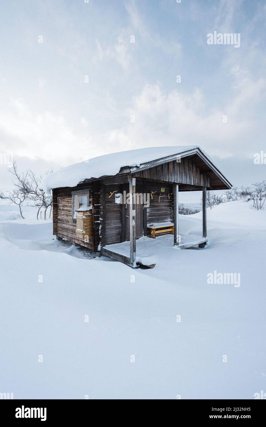 Small hut surrounded by snow in Finnish Lapland Stock Photo - Alamy