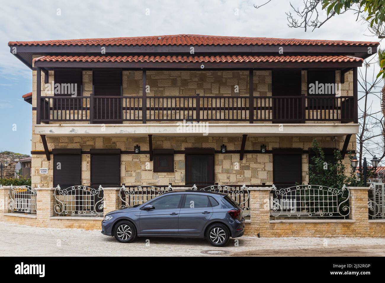 Side; Turkey – March 01 2022: blue Volkswagen Polo is parked on a warm ...