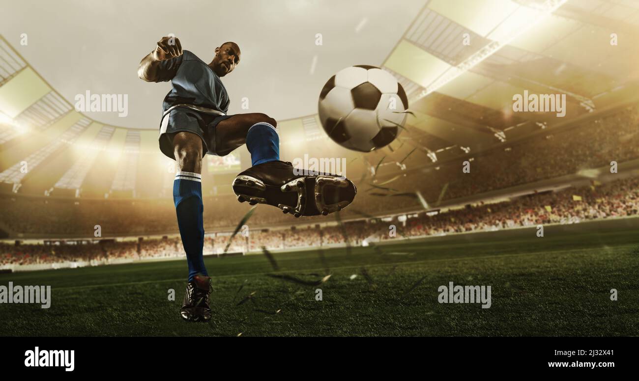 Professional soccer player in action at the stadium with flashlights