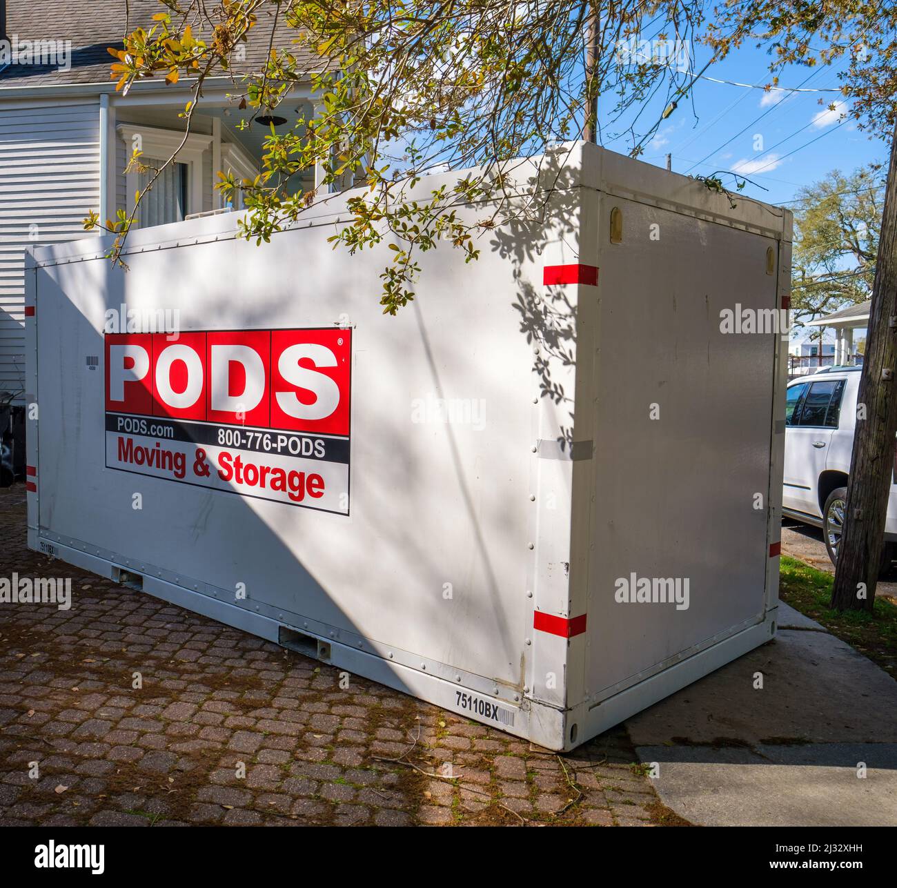 NEW ORLEANS, LA, USA - MARCH 24, 2022: Pods Moving and Storage container in driveway of Uptown New Orleans home Stock Photo