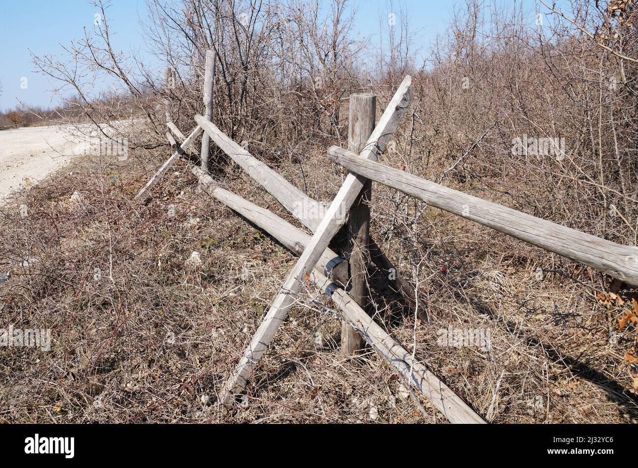 old broken wooden fence in the countryside. Stock Photo