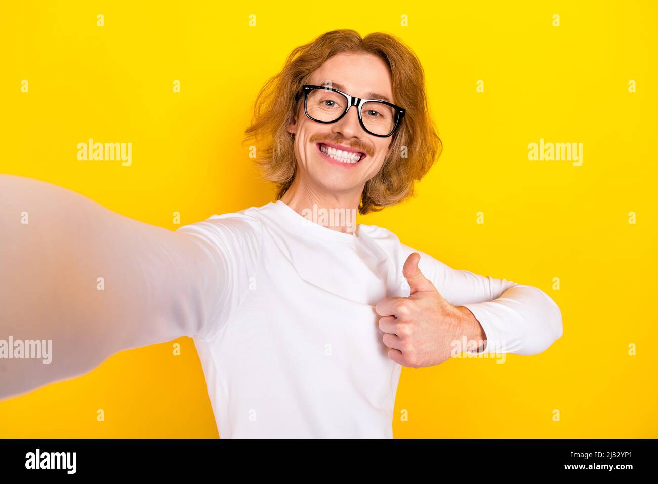 Portrait of funky cheerful expression student male take selfie showing ...