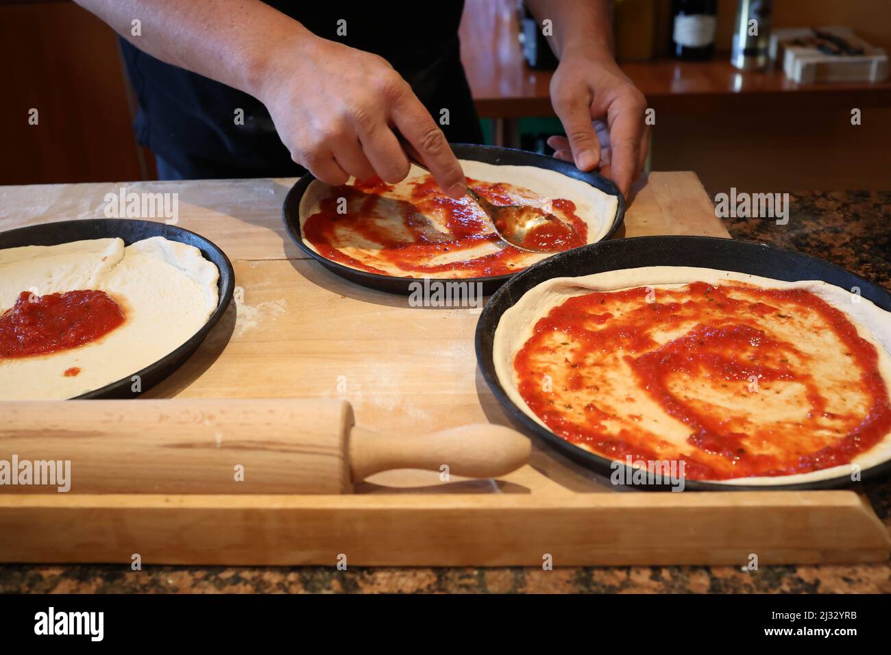 Bake original Italian pizza at home Traditional preparation Stock