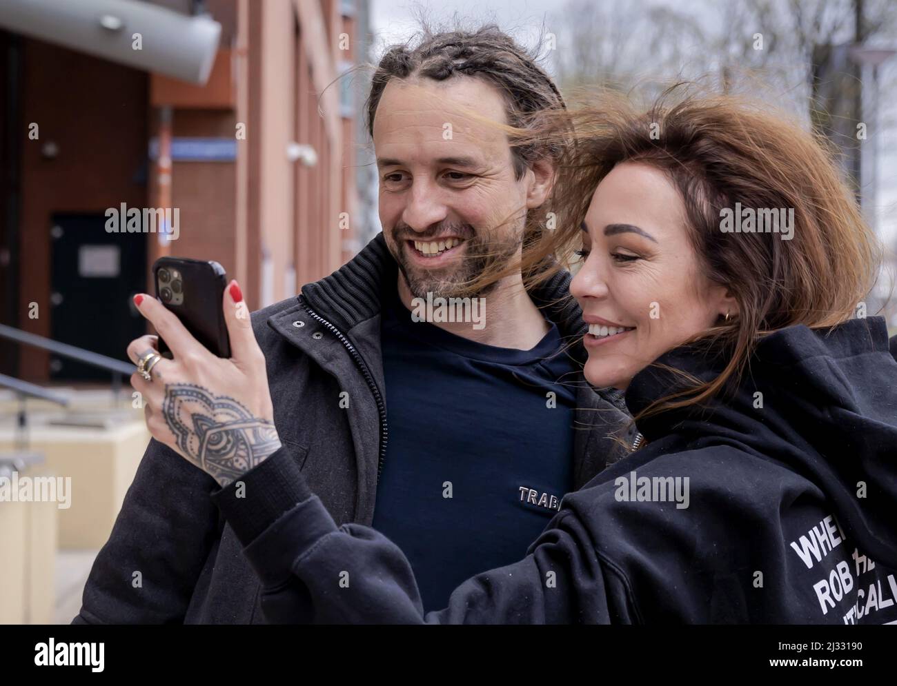 2022-04-05 14:30:10 ROTTERDAM - Willem Engel is welcomed by his girlfriend Dorien Rose leaves the court after his remand has been lifted. The foreman of Viruswaarheid was arrested again on April 3, after various media outlets published a conversation with Engel recorded in the studio of Café Weltschmerz. Engel's pre-trial detention was suspended on the condition that he would not make any statements on social media. ANP ROBIN VAN LONKHUIJSEN netherlands out - belgium out Stock Photo