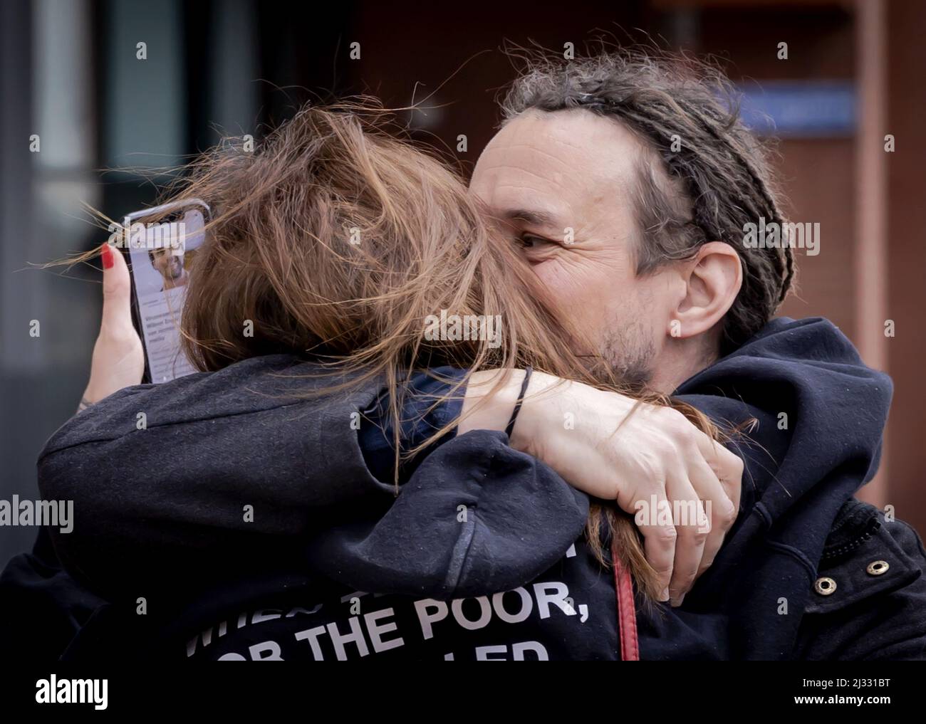 2022-04-05 14:30:08 ROTTERDAM - Willem Engel is welcomed by his girlfriend Dorien Rose leaves the court after his remand has been lifted. The foreman of Viruswaarheid was arrested again on April 3, after various media outlets published a conversation with Engel recorded in the studio of Café Weltschmerz. Engel's pre-trial detention was suspended on the condition that he would not make any statements on social media. ANP ROBIN VAN LONKHUIJSEN netherlands out - belgium out Stock Photo