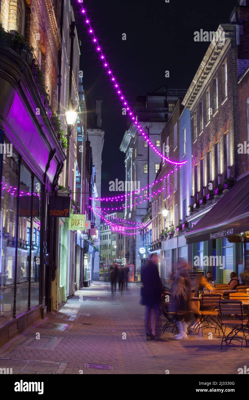 Pink Lights Above Foubert's Place and the Trendy Night Life in Carnaby, London, United Kingdom Stock Photo