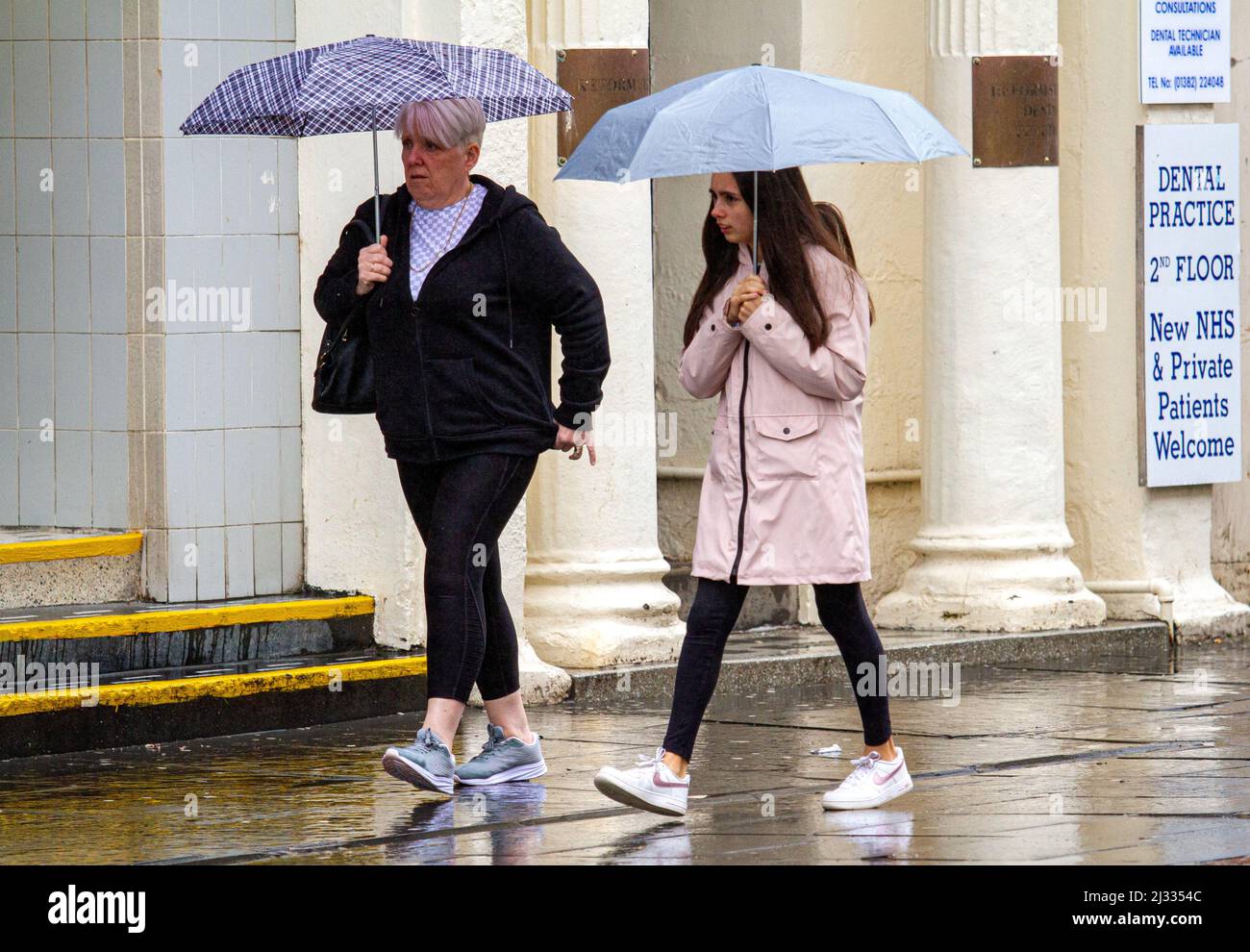 Dundee, Tayside, Scotland, UK. 5th April 2022. UK Weather: Temperatures in Tayside reached 8°C on a dreary and damp day, with heavy rain showers rolling across North East Scotland. The heavy showers haven't stopped locals from socializing and shopping in Dundee city centre for the day. Credit: Dundee Photographics/Alamy Live News Stock Photo