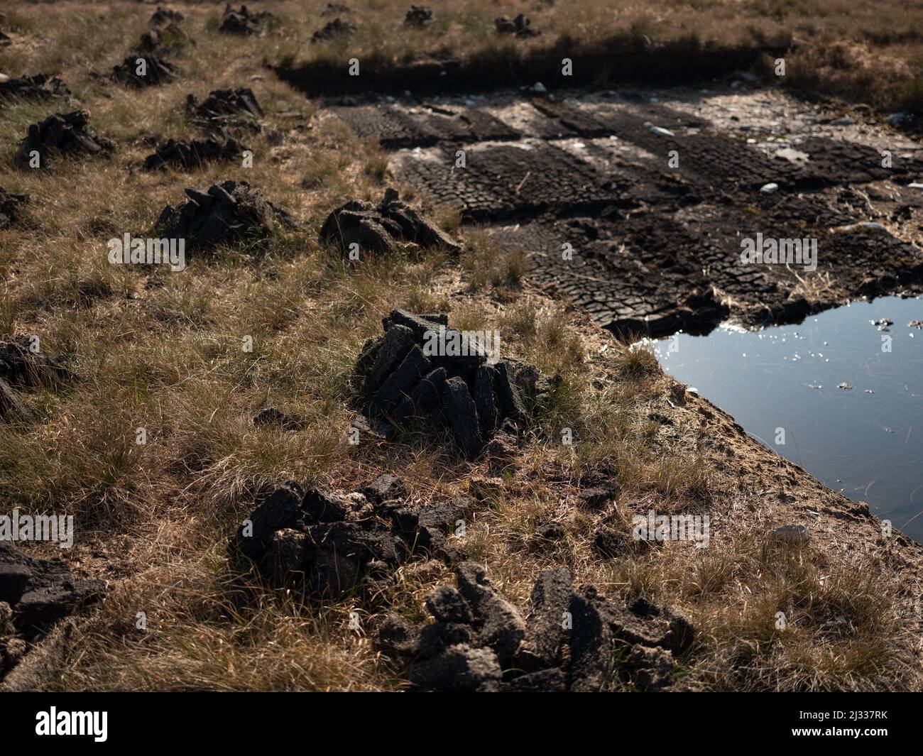 Turf cutting in a peat bog in Connemara, County Galway, Ireland. Stock Photo