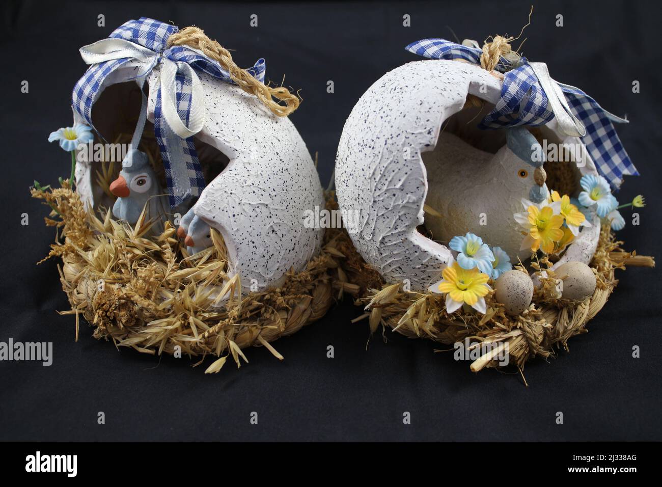Easter decorations. Easter eggs. Coloured eggs. Decorated eggs. Eggshell with chicken inside. Resurrection celebration. Spring event. Religious. Stock Photo