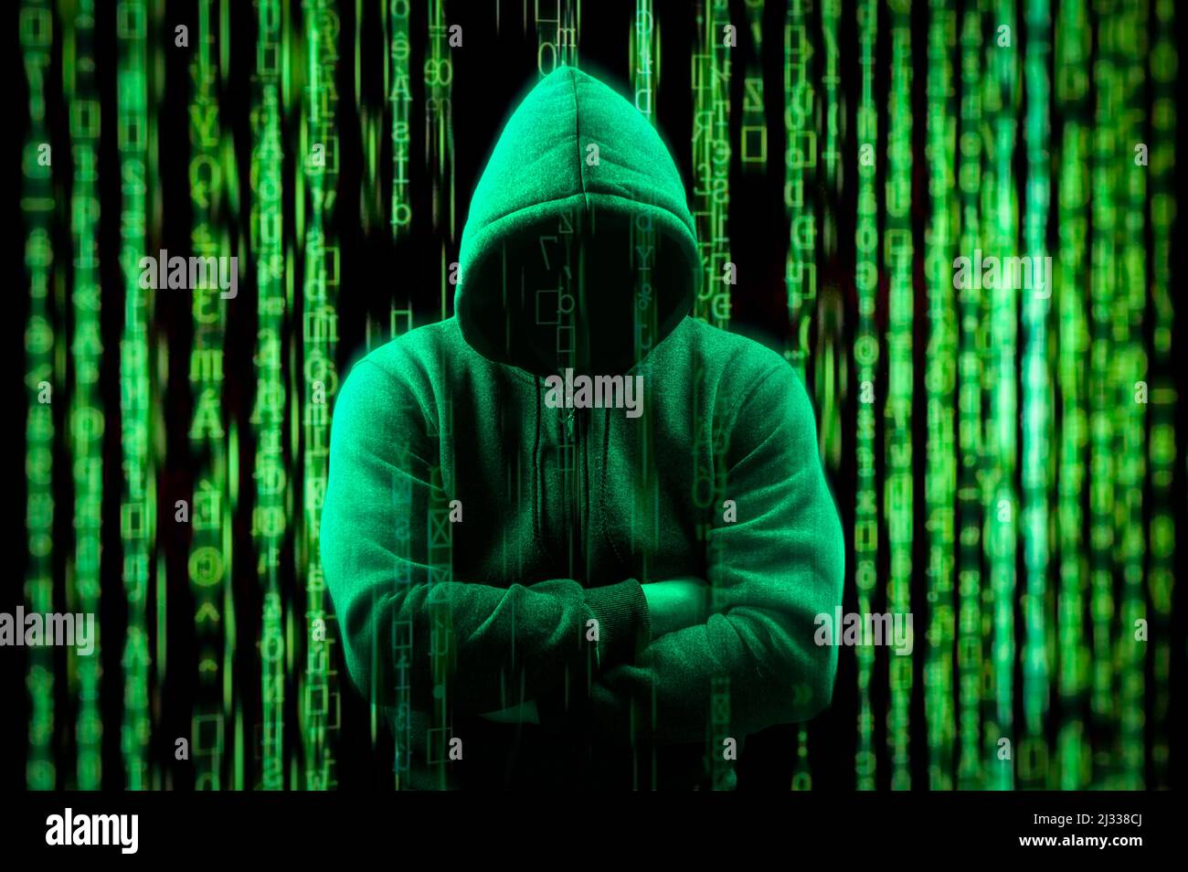 hacker Silhouette on dark green binary background. Hacker on matrix digital background. Hacking and malware concept. Be aware of hacker attack. Facele Stock Photo