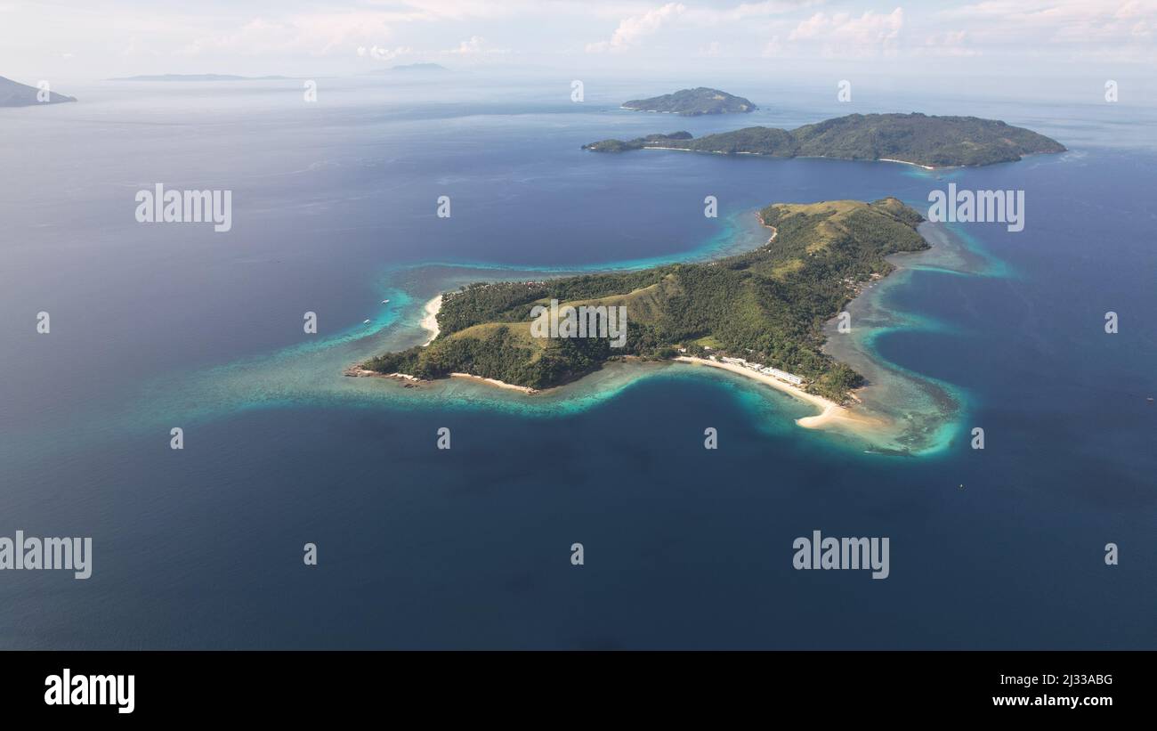 The aerial shot of Logbon Island, a small island of the coast of Romblon, Philippines. Stock Photo