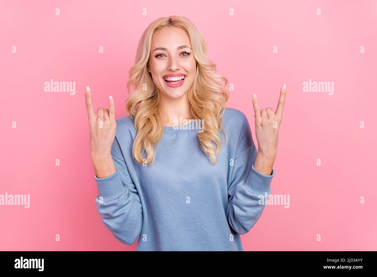 Photo of young pretty girl show fingers rock symbol heavy punk swag ...