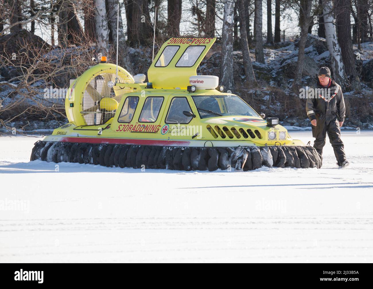 HOVERCRAFT from Swedish sea rescue society have a coffebreak on the ice of lake Hjälmaren in Södermanland Sweden Stock Photo