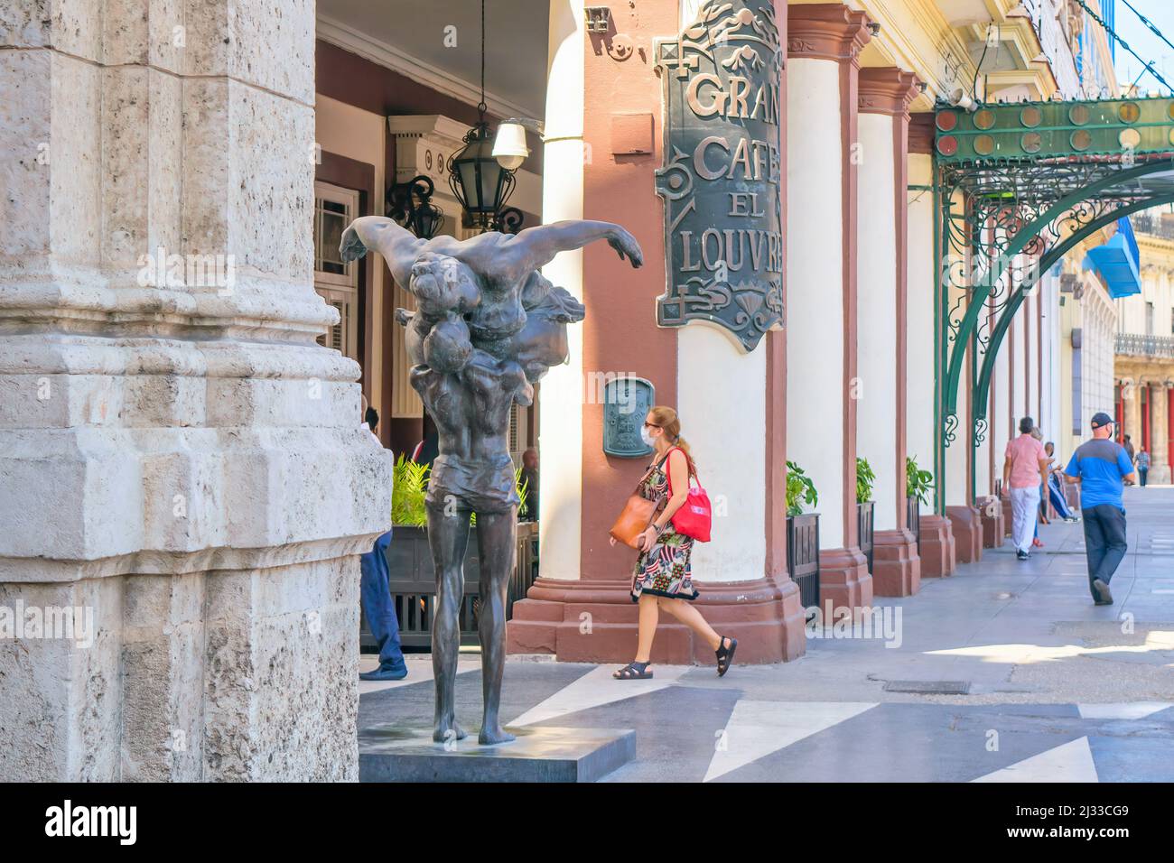 Metallic sculpture or urban art in the sidewalk of the famous Gran Cafe El Louvre in the central district of Havana city. This area is a famous place Stock Photo