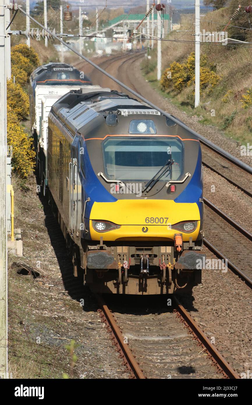 Direct Rail Services DRS class 68 UK Light diesel-electric loco, 68007 leads a nuclear flask train away from the West Coast Main Line 1st April 2022. Stock Photo