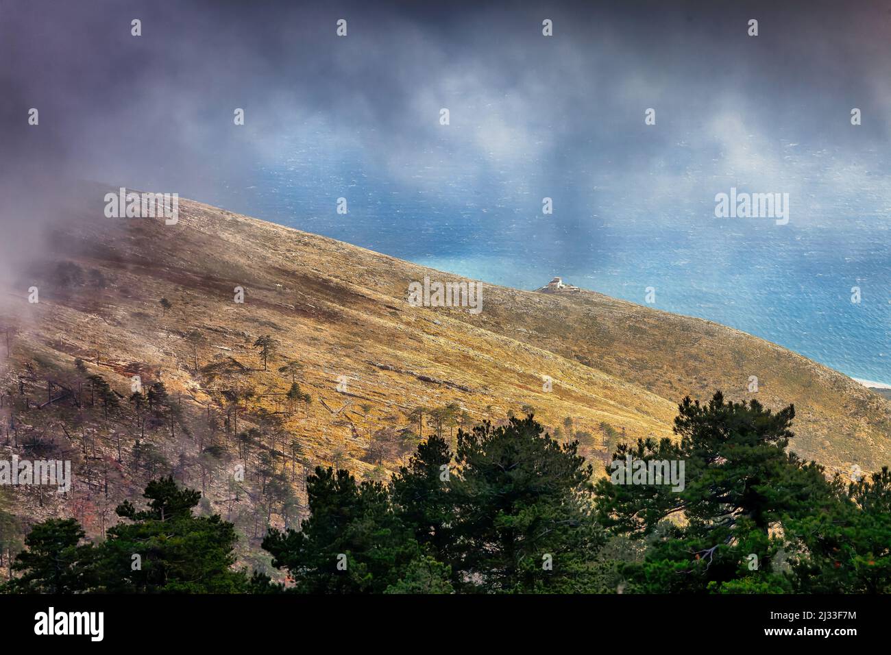 Llogara pass on a very cloudy day in Albania Stock Photo