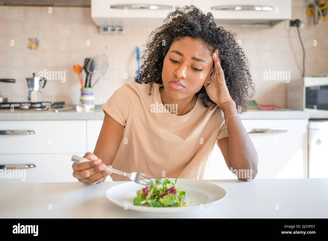 One black woman feeling hungry eating poor calories food for diet Stock Photo