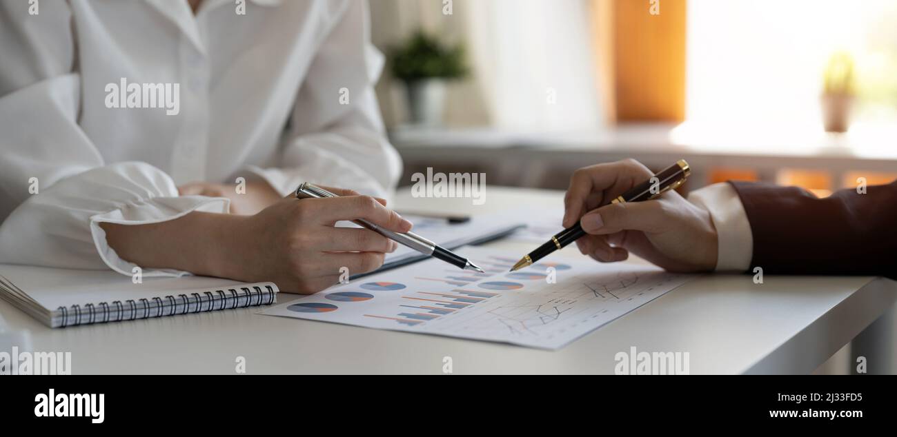 Business People Meeting to analyse and discuss and brainstorming the financial report chart data in office, Financial advisor teamwork and accounting Stock Photo