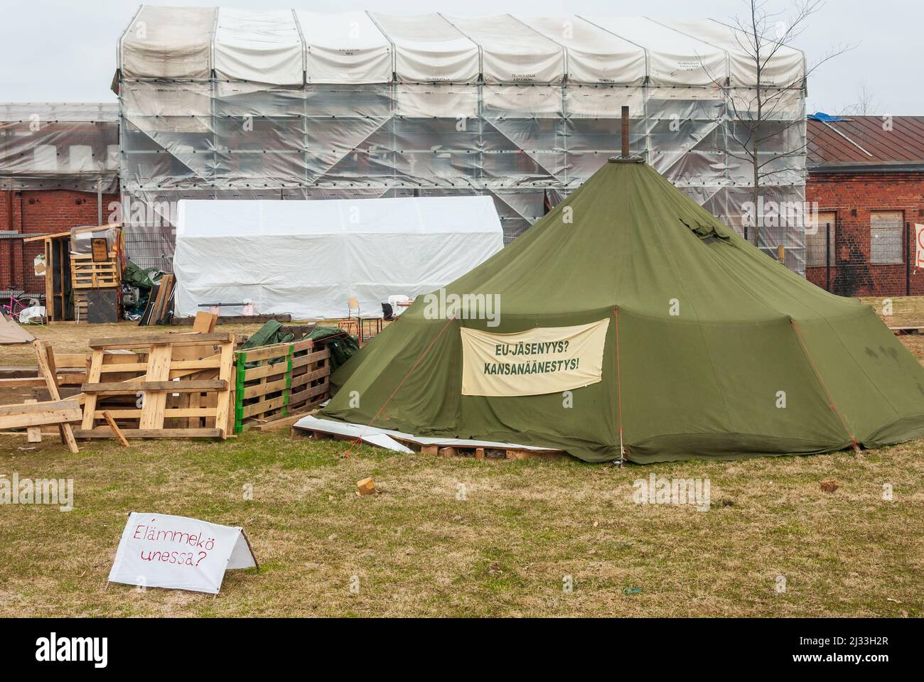 Demonstation of EU membership camp with a green canvas tent at KAnsalaistori in Helsinki Finland Stock Photo