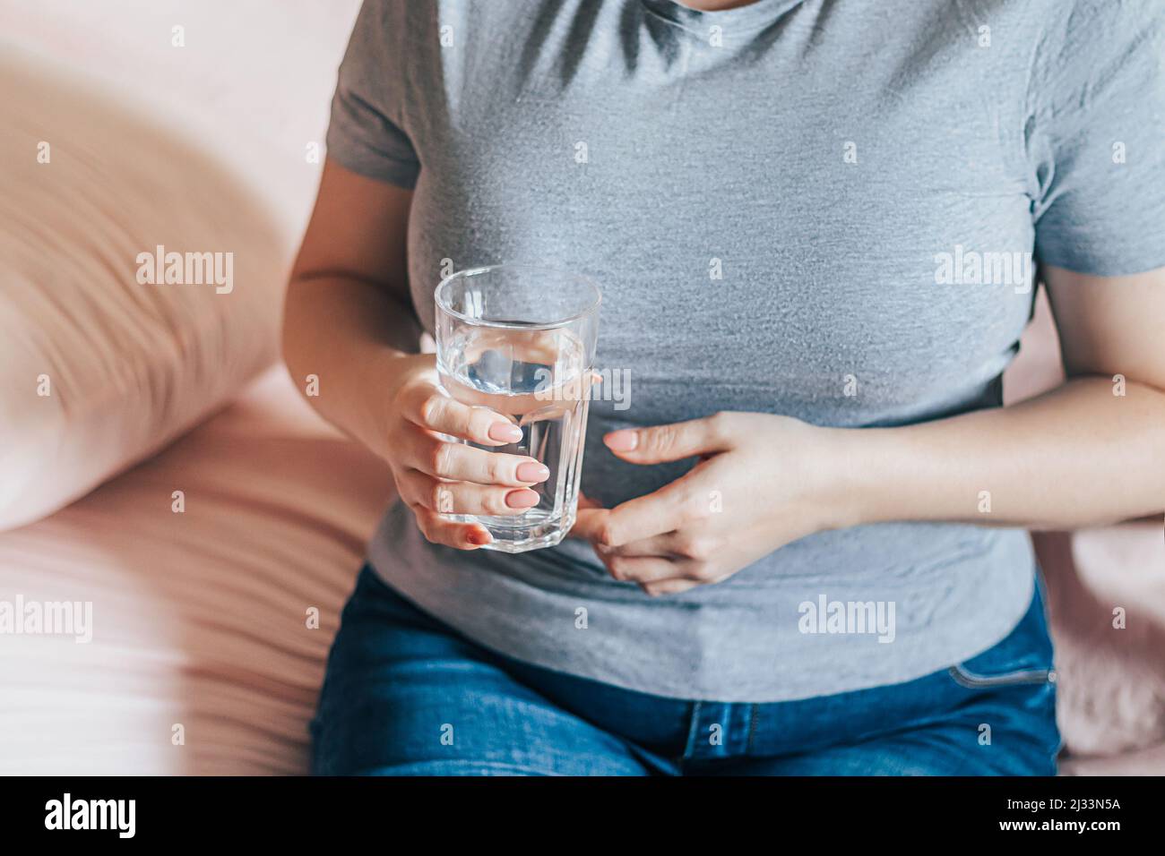 World Water Day. Woman holds glass of clean water in her hands. Health