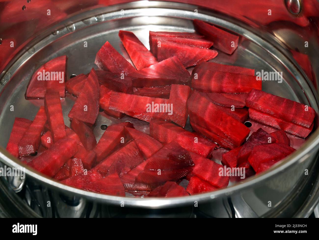Beets cut in steaming pan Stock Photo