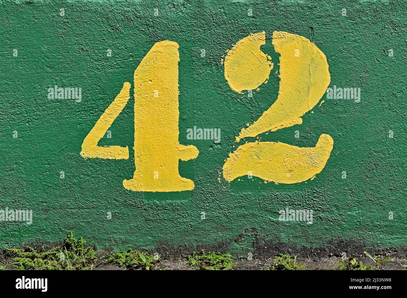 Number 42 Painted In Yellow On A Green Wall Stock Photo Alamy number-42-painted-in-yellow-on-a-green-wall-stock-photo-alamy