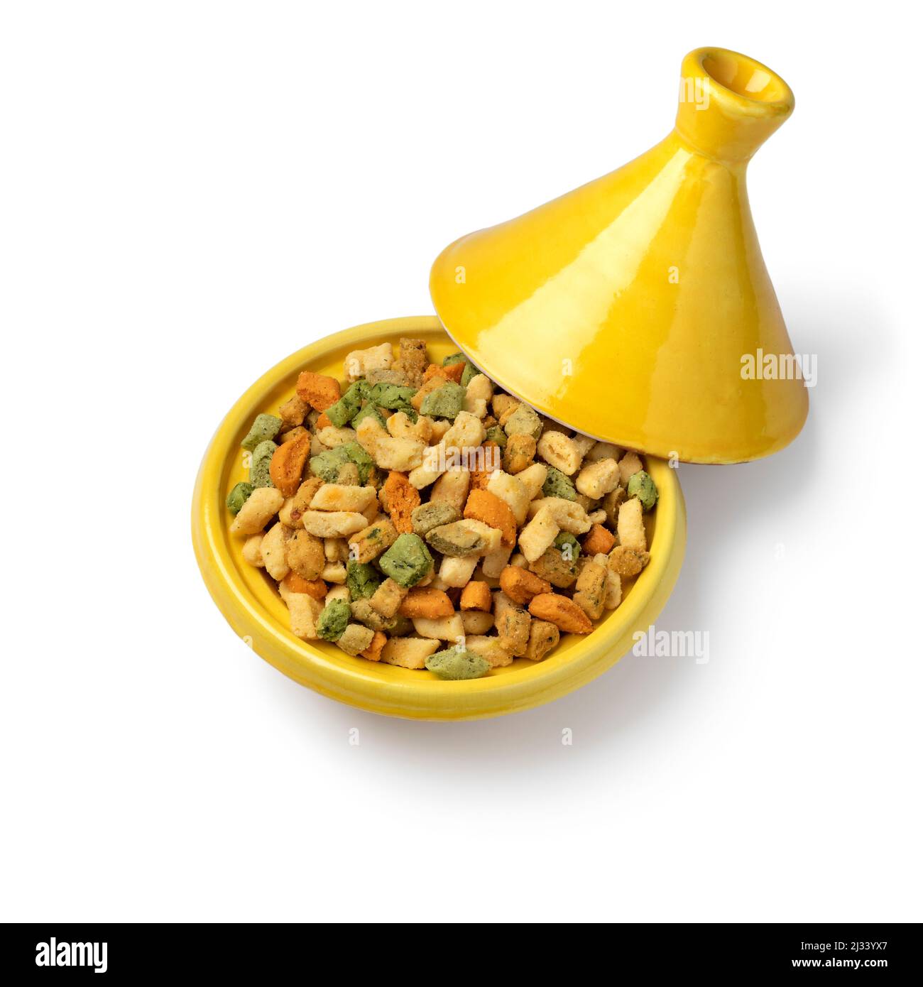 Tajine with colorful miniature shortbread cookies isolated on white background Stock Photo