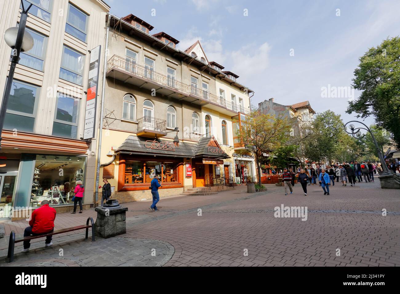 Zakopane, Poland - September 23, 2016: Townhouse called Podhale on the Krupowki street. On the ground floor the entrance to the grocery store, decorat Stock Photo