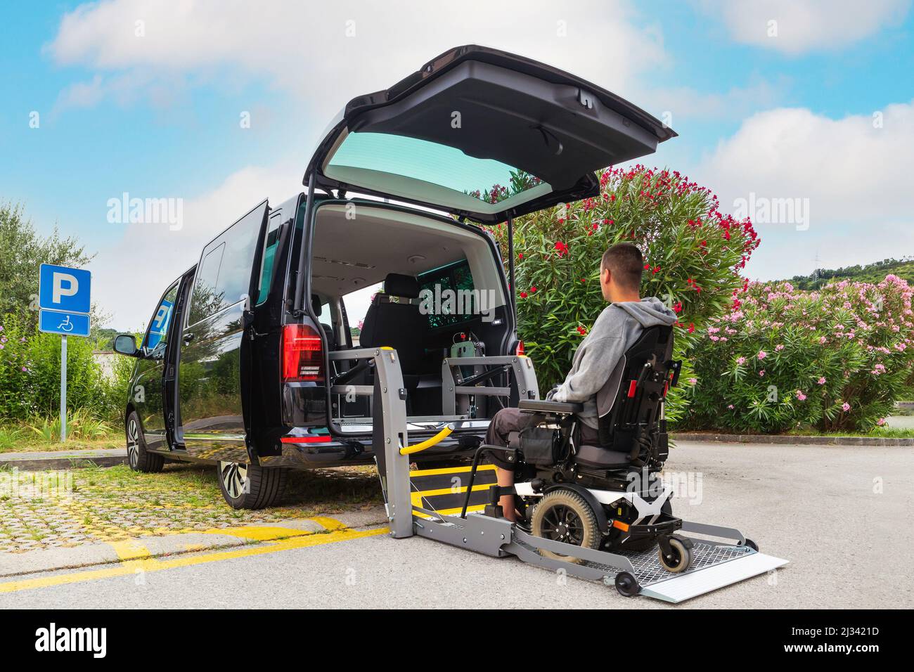 Accessible car with wheelchair lift ramp for person with disability