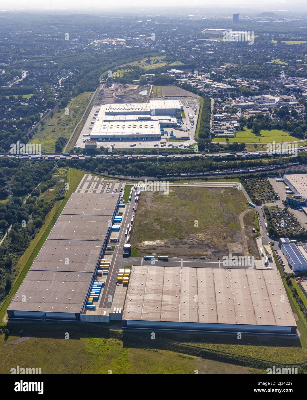 Aerial photograph, SEGRO Logistics Park Oberhausen, Edeka central warehouse Oberhausen and Sterkrade colliery with historic winding tower in the backg Stock Photo