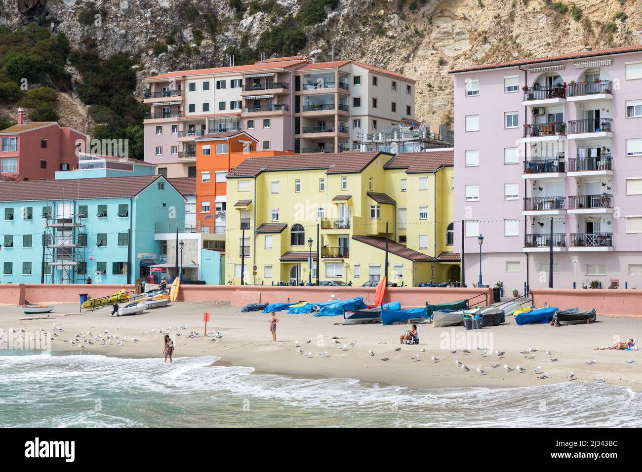 People on the beach at Catalan Bay Beach, Gibraltar Stock Photo