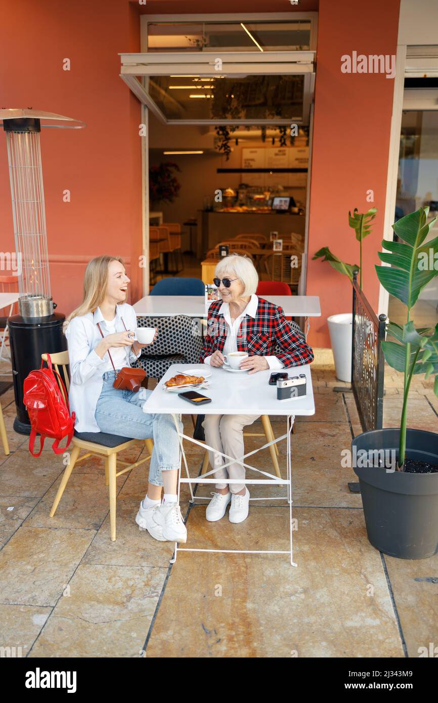 Two happy women having coffee in cafe Stock Photo
