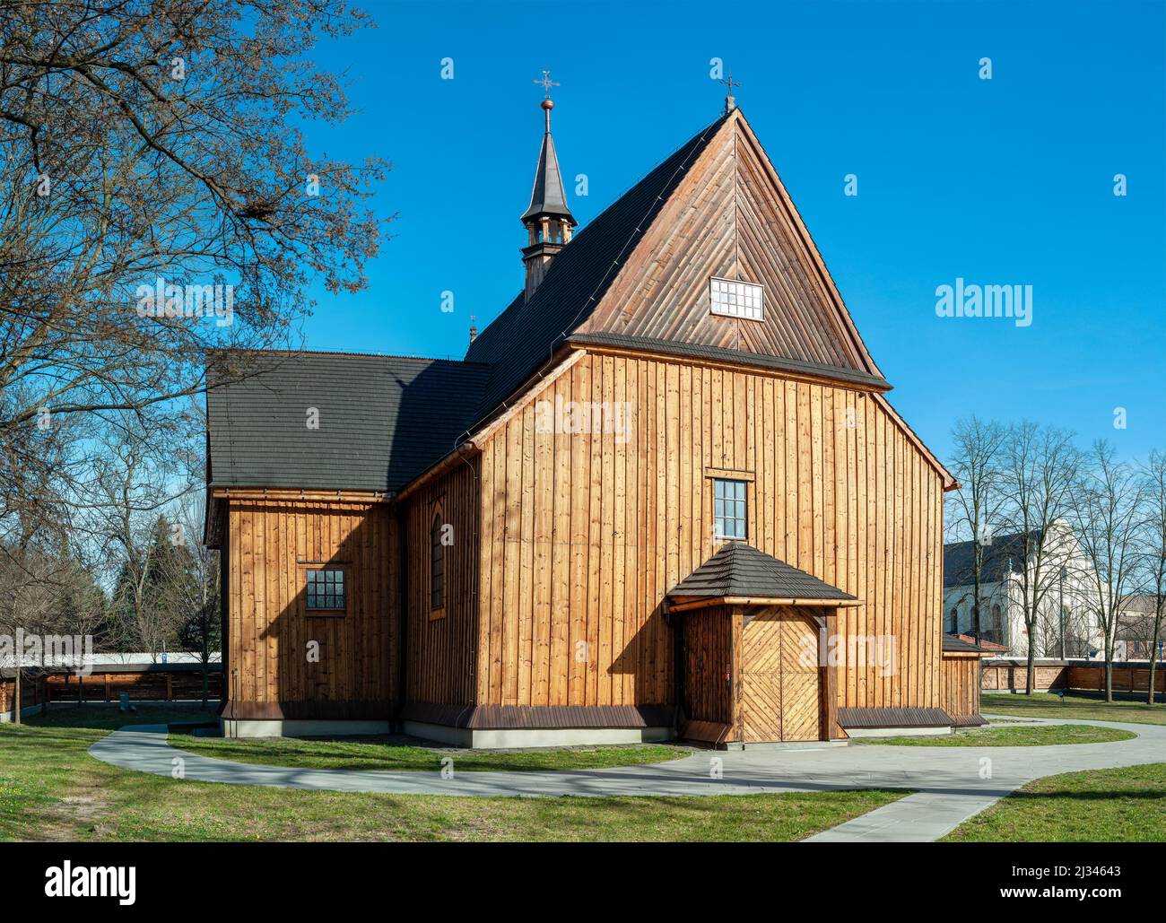 Old Gothic larch wooden St. Bartholomew’s Parish Church in Mogiła, Krakow, Poland. Built in 15th century with later modifications in 18th century Stock Photo
