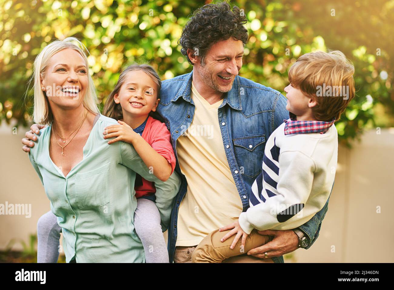 Making some fun memories together. Cropped shot of a happy family spending quality time together outside. Stock Photo