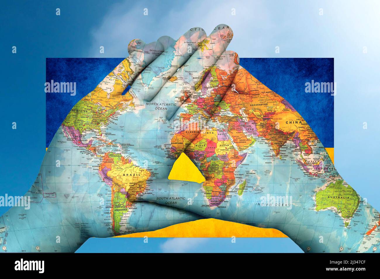 world map in hands against the sky Stock Photo