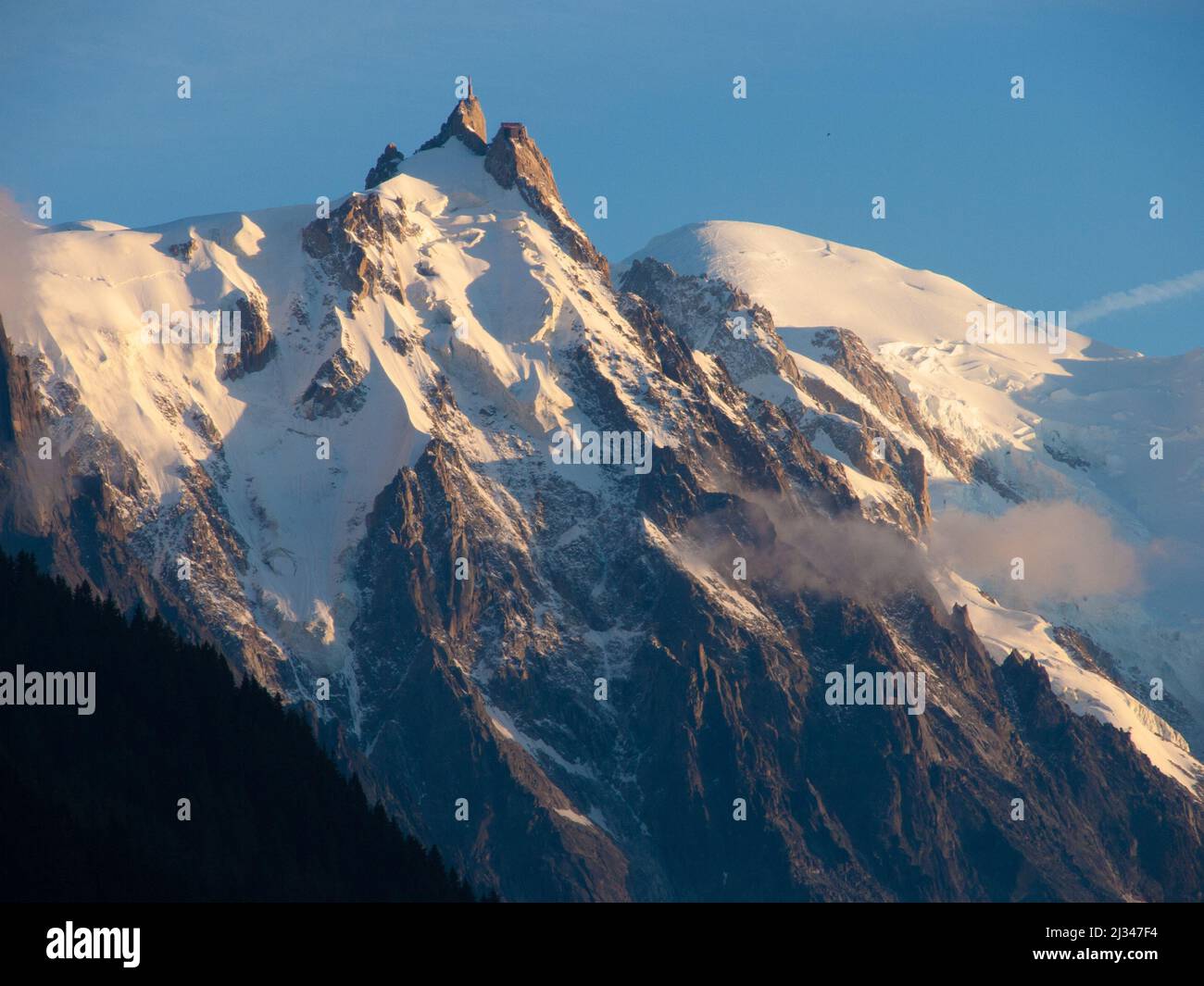 An aerial view of the snowy mountains of Aiguille du Midi, France under ...